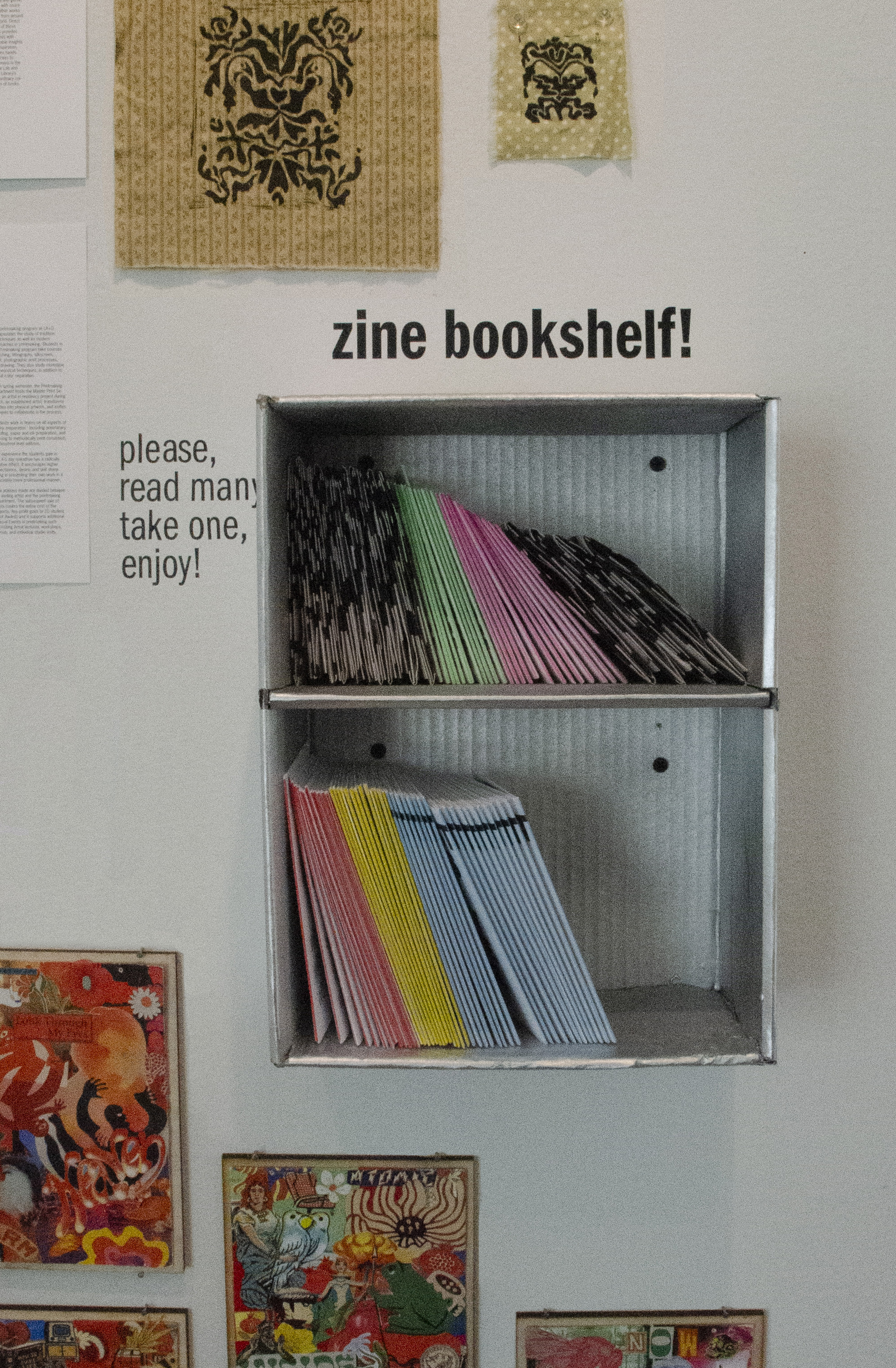 zine bookshelf encouraging people to read and take home my zines at my senior exhibit